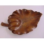 A continental carved wooden tray in the form of a leaf