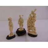 Three late 19th century Japanese carved ivory figurines on carved wooden bases