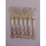 A set of six Victorian Queens pattern silver table forks, crest engraved to the terminals, London