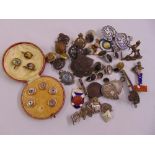 A quantity of collectables to include cased button studs, medallions and badges