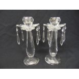 A pair of Villeroy & Boch cut crystal candlesticks with drops on raised circular bases, A/F