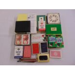 A quantity of playing cards and bridge related items
