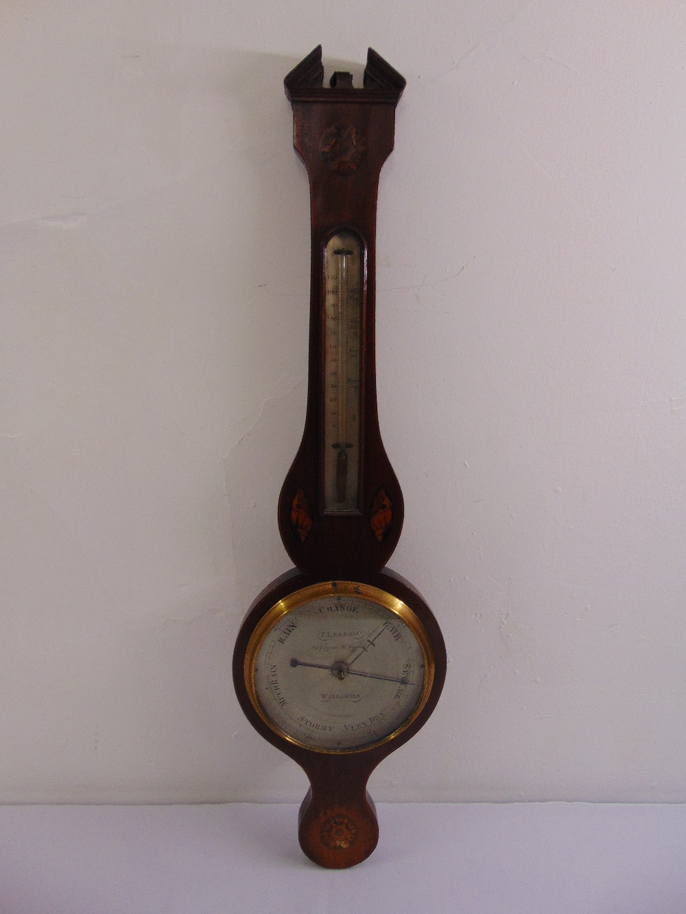 A 19th century mahogany and satinwood inlaid banjo barometer by P Lerra & Co of Sheffield