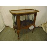 A rectangular mahogany and glass cabinet on four cabriole legs with detachable tea tray