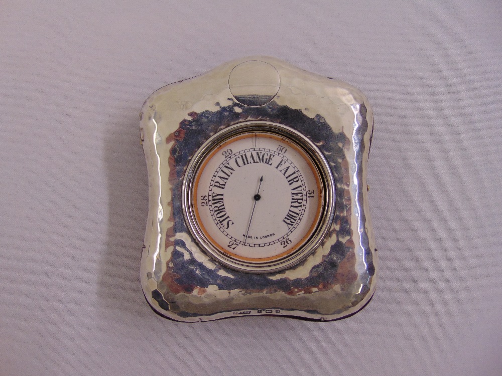 A Victorian barometer in hallmarked silver hand hammered case