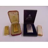 Four cigarette lighters to include Dunhill and Ronson, two in fitted cases