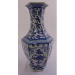 A Chinese Qianlong period hexagonal blue and white vase decorated with flowers and leaves, six