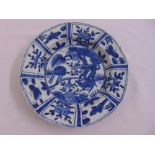 A Chinese blue and white export market dish decorated with animals and flowers