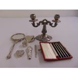 A quantity of silver and white metal to include a two branch candelabrum and three pill boxes (8)