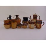 A quantity of Royal Doulton Lambethware to include a tobacco jar, a mug and jugs (10)