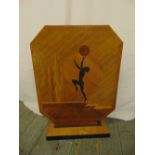 An Art Deco shaped rectangular wooden fire screen inset with a female figure on raised rectangular