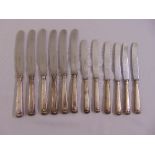 Six silver handled fiddle and shell pattern table knives and six matching dessert knives