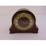 An early 20th century mahogany mantle clock, silvered dial, Arabic numerals