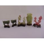 A quantity of jade and rose quartz figurines to include animals and birds