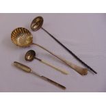 A silver ladle, a silver ladle with ivory, a toddy ladle and a marrow scoop