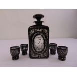 A Bohemian style rectangular liquor decanter and four matching glasses