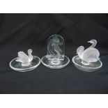 Three Lalique pin trays, with applied swans and a female nude