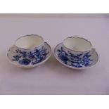 Two Meissen blue and white cups and saucers, A/F