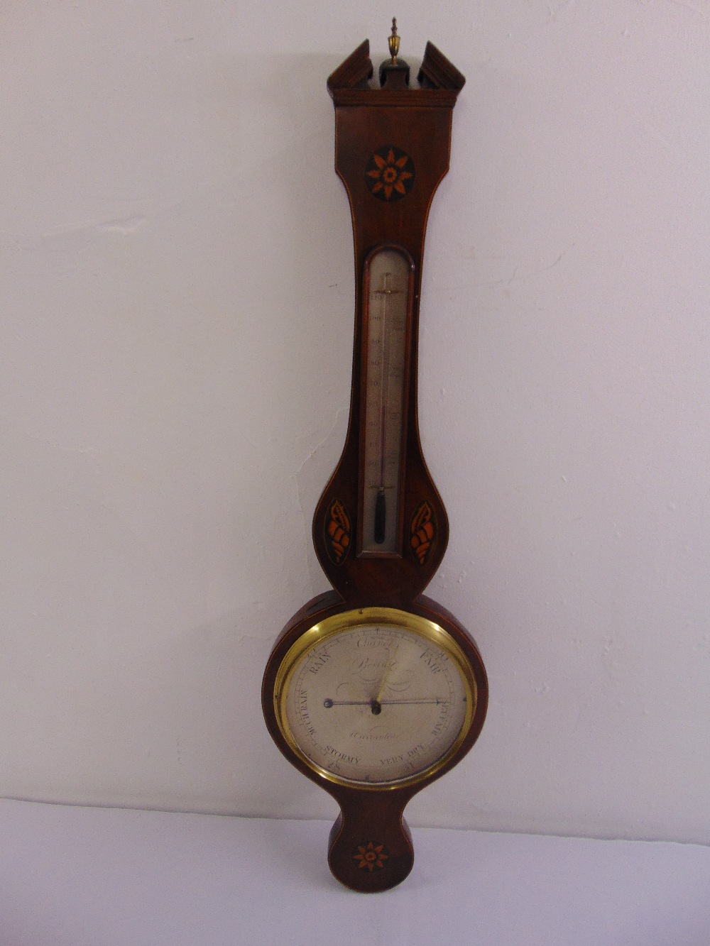 A 19th century mahogany wheel barometer by Borini, with thermometer, shell and floral inlaid case