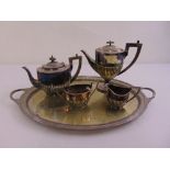 A silver plated two handled oval tray and a four piece silver plated tea and coffee set