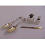 A quantity of silver to include two tablespoons, a letter opener and two dressing table bottles with