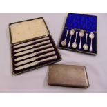 A cased set of six silver teaspoons, a cased set of six silver handled butter knives and a silver