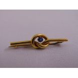 18ct yellow gold and sapphire knot brooch, approx total weight 2.9g