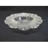 A Lalique bowl of shaped circular form decorated with stylised leaves, signed to the base