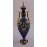 A Royal Worcester covered vase of baluster form with angled side handles on raised circular foot A/