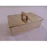 A silver rectangular cigarette box with double hinged sides and carrying handle, cedarwood lined,
