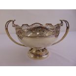 A silver two handled rose bowl with two pierced scrolling handles on raised circular base,