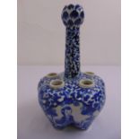 A Chinese blue and white tulip vase decorated with figures and organic forms, marks to the base