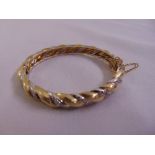 Yellow and white gold and diamond rope twist bangle, tested 14ct, approx total weight 38.8g