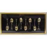 A set of six silver teaspoons mounted in a glazed frame (for Potters Bar Golf Club)