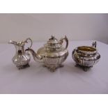 A Victorian three piece silver tea set to include a teapot, twin handled sugar bowl and milk jug