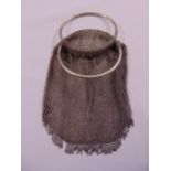 A continental white metal ladies mesh bag with circular loop handles