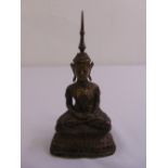 A 19th century oriental bronze figurine of a seated Buddha on raised oval plinth