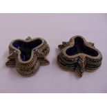 A pair of Doulton Lambeth salts, triform, marks to the base 1875