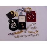 A quantity of costume jewellery to include Chanel earrings, a Dior bracelet, other fashion