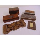 A quantity of treen to include covered boxes, a bookend, a photograph frame and a tea caddy