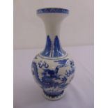 A Chinese blue and white baluster vase decorated with dragons and bats