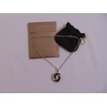 A Bulgari steel and 18ct gold optical spinning pendant set with black onyx on a related chain,