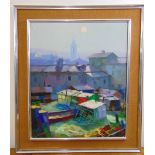 A framed oil on canvas of buildings in the sunlight indistinctly signed bottom left and dated