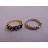 A diamond and white gold half eternity ring and a sapphire and diamond half eternity ring, both