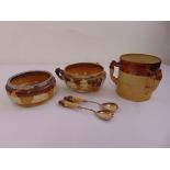 A quantity of Doulton Lambeth ceramics to include three bowls and a pair of salad servers