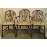 Three Windsor chairs with cushion seats