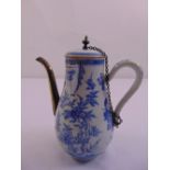 A 19th century continental blue and white pear shaped chocolate pot decorated throughout with