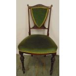 An Edwardian mahogany occasional chair with upholstered seat and back