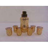 An Art Deco glass cocktail shaker and six matching shot glasses