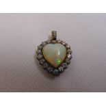 An opal and diamond heart shaped pendant set in gold and silver, approx total weight 5.6g